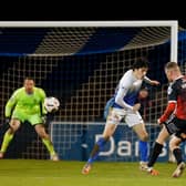 Ben Kennedy curls home a fine strike to increase Crusaders’ advantage over Glenavon. Pic by Pacemaker.