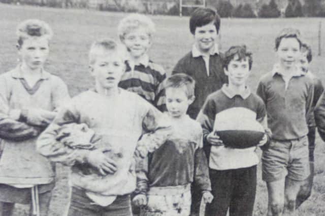 Youngsters pose for a picture after their mini rugby training session at Eaton Park. 1989