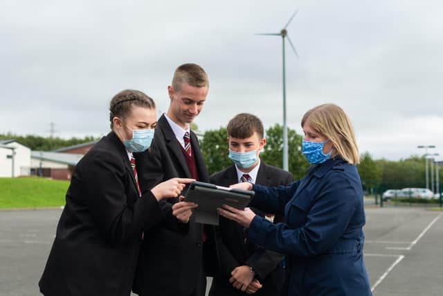 Pupils Leah Wasson, Luke Shields and Jake Anderson with Sandra Patterson, head of Geography, Ulidia Integrated College.