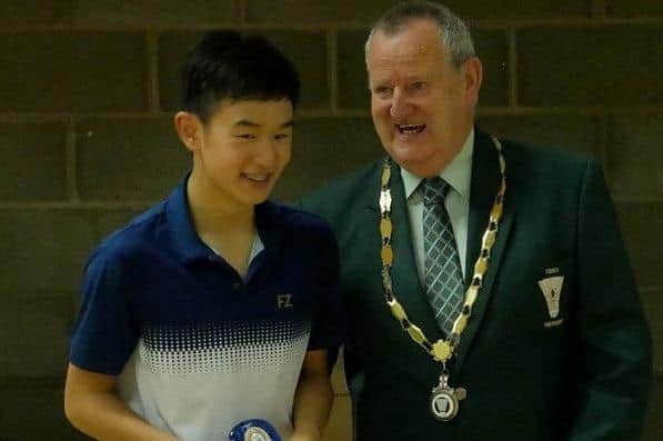 Matthew Cheung shares a joke with Ulster Badminton's William Martin