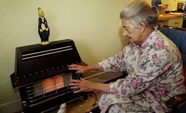 28/11/2001
AN ELDERLY LADY WARMS HERSELF BY HER GAS FIRE.  MANY OLDER PEOPLE ARE PREPARING THEMSELVES FOR THE ONSLAUGHT OF WINTER AND DROPPING TEMPERATURES.