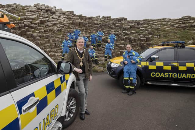 Station Officer Alastair Simpson and team from Coleraine Coastguard pictured with Mayor of Causeway Coast & Glens Richard Holmes at the Giants Causeway during their celebration of 200 years of HM Coastguard at 11am on January 15, 2022. Picture Kevin McAuley/McAuley Multimedia