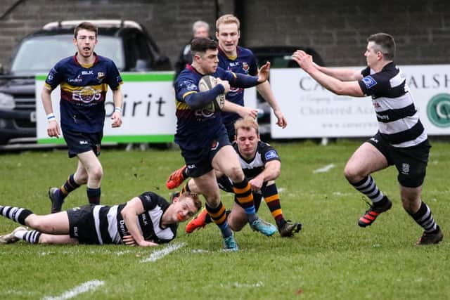 Adam Doherty leaves the Old Belvedere defenders in his wake. Picture: John Mullan