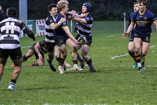 Rob Lyttle off-loads to Joe Finnegan. Picture: John Mullan