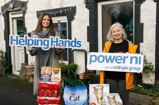 Power NI employee Lauren Scott with 7 th Heaven trustee Heather McMurray.