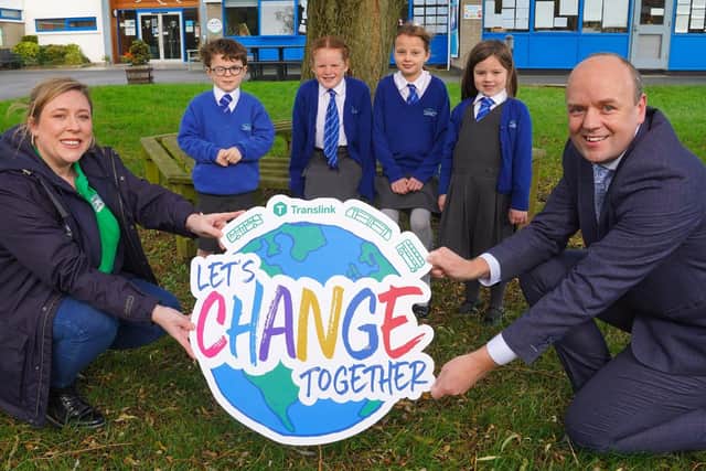 Niamh Nic Cana from Keep Northern Ireland Beautiful and Translink Safety and Corporate Responsibility Manager, John Thompson, launch this year's Translink Eco Schools Travel Challenge   photo by Aaron McCracken