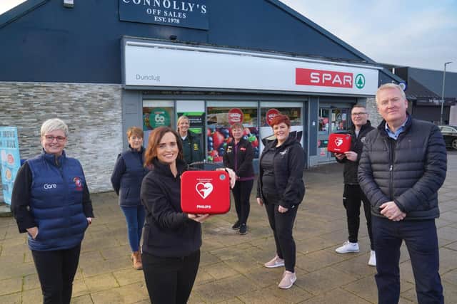 Recipients of Connolly’s SPAR defibrillator fundraiser meet to collect their new devices. Pictured (L-R) are Clare Caufield from Bravehearts NI, Francine Scullion from All Saints Youth Club’s Geraldine Donnolly School of Dancing, Sinead Connolly from Connolly’s SPAR, NI Ambulance Service Community Resuscitation Lead Stephanie Leckey, Liz McCrystal from SureStart Nursery, Gail Kinkead from Healthy Kidz, Paul Kelly from All Saints Youth Club Boxing Club and Eugene Reid from Harmony Hub.