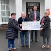 Pictured at the cheque presentation are  Sean O’Kane, his sister Rose Marie McCracken from Cookstown, and representing the Robinson Hospital Board of Trustees David Robinson President, Margaret Allison Vice President, and Dr John Flynn Hon. Secretary.