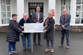 Pictured at the cheque presentation are  Sean O’Kane, his sister Rose Marie McCracken from Cookstown, and representing the Robinson Hospital Board of Trustees David Robinson President, Margaret Allison Vice President, and Dr John Flynn Hon. Secretary.