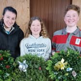 Harry and Molly Lyttle once again raised vital funds for Alzheimer’s Society by creating and selling Christmas Wreaths. They are pictured with Lucy McClintock.