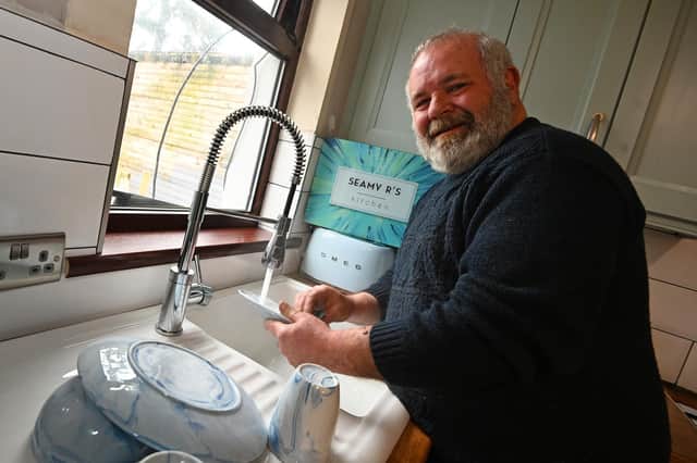 Seamus Rafferty first to be connected to gas network in Coalisland.