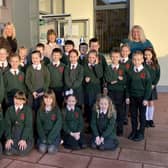 Back Row: Mrs Allen (Dromore Central Primary School Principal), Mrs Murphy (P4 Teacher), Mrs Bentley (Vice Principal) and Mrs Esther Morrison (Dromore Branch Library Manager). Children: Mrs Murphy’s P4 Class