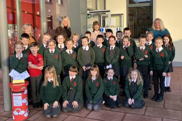 Back Row: Mrs Allen (Dromore Central Primary School Principal), Mrs Murphy (P4 Teacher), Mrs Bentley (Vice Principal) and Mrs Esther Morrison (Dromore Branch Library Manager). Children: Mrs Murphy’s P4 Class
