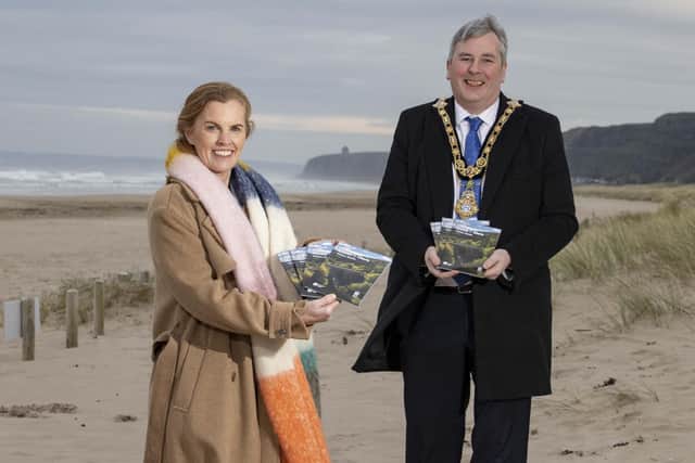 The Mayor of Causeway Coast and Glens Borough Council Councillor Richard Holmes pictured at Benone with Destination Manager Kerrie McGonigle for the launch of the latest Causeway Coast and Glens Visitor Guide which is available now