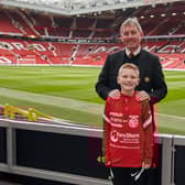Ben Dickinson, from Larne, with Manchester United legend Bryan Robson.