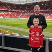 Ben Dickinson, from Larne, with Manchester United legend Bryan Robson.