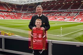 Ben Dickinson, from Larne, with Manchester United legend Bryan Robson.