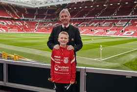 Ben Dickinson, from Larne, with Manchester United legend Bryan Robson.