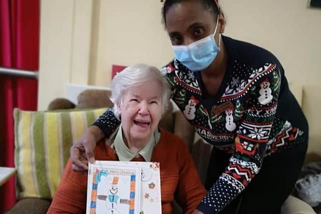 Resident and staff member from St. Francis Care Home.