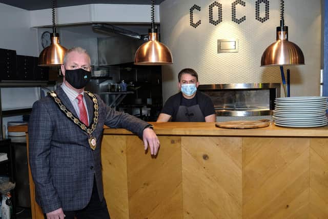 Chair of Mid Ulster District Council, Councillor Paul McLean, is pictured with Conor Donnelly from Coco Craft Pizza, Magherafelt, one of the businesses that benefitted from the Council’s Business Marketing Grant scheme.