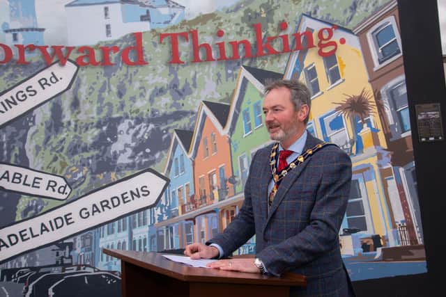 The Mayor of Mid and East Antrim, Cllr William McCaughey, addressing members of the community about the mural depicting the history and heritage of Whitehead.