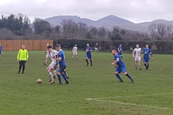 Rangers Reserves player Shea Byrne holds up the ball against Hanover Reserves