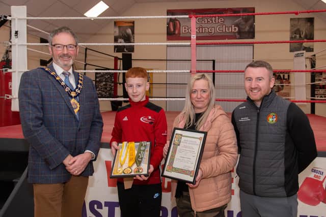 Multi championship winning boxer Harvey Cochrane and mum Karen with the Mayor of Mid and East Antrim, Councillor William McCaughey and Boxing Development officer Paddy Barnes.