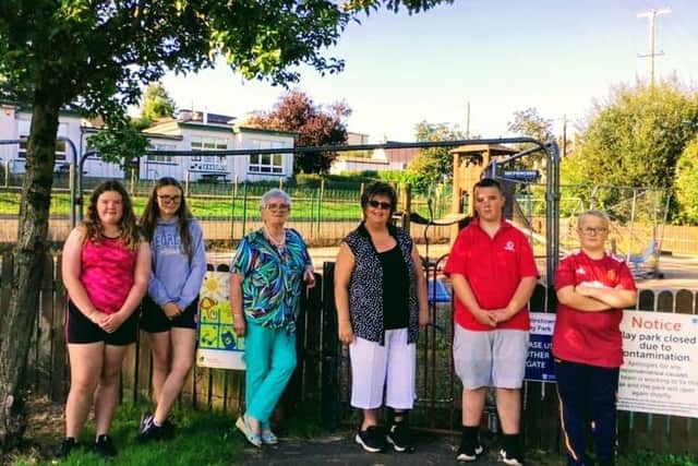 Councillor Beth Adger at the play park in Martinstown with Marion Maguire and local young people