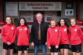 Cllr Michael Stewart with the five players Love Ballyclare will be sponsoring for the season.
