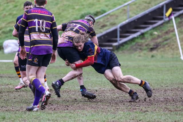 Marcus McNeill puts in a crunching tackle for Bann Fourths at Instonians. Picture: John Mullan