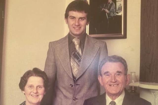 Mervyn Currie pictured with his parents Hannah and Robert Currie.