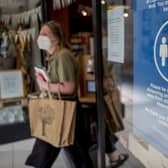 A customer wearing  a face mask as a precautionary measure against spreading Covid-19. Picture: Getty