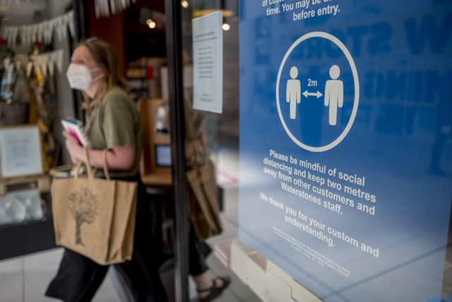 A customer wearing  a face mask as a precautionary measure against spreading Covid-19. Picture: Getty