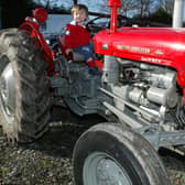 Two-year-old Patrick Leech from Dromore on a Massey Ferguson 35 at the Glenavy and District Vintage Car Rally which was held in March 2007. Picture: Colm O’Reilly/Ulster Star archives