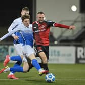 Glenavon’s Jack O’Mahony challenges Crusaders’ Jude Winchester. PICTURE: Stephen Hamilton/Inpho