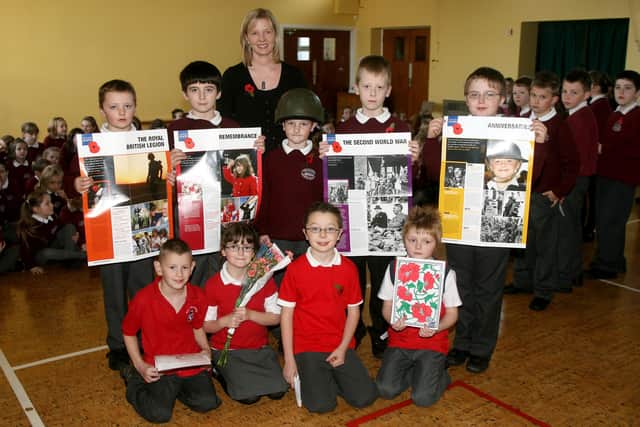 Primary 5 and 6 pupils from The Diamond PS who took part in the schools annual Remembrance Day assembly. Included is teacher Mrs. B. McKibben. BT45-202AC