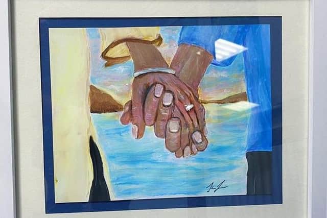 A piece of art Keris created of Michael and Phyllis holding hands