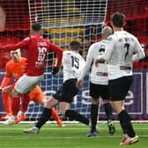 Lee Lynch fires home the winning goal in Larne’s victory over Glentoran. Pic by PressEye Ltd.