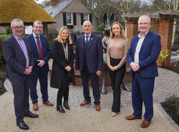 Martin Agnew, joint managing director of Henderson Group, with Alan Abraham and Charlene McGonagle from Henderson Wholesale, Gary Reid and his daughter Holly Reid, and logistics director, Pat McGarry.