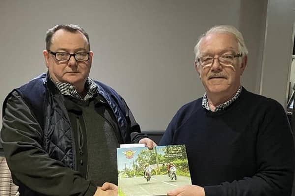 making the recent presentation to Jim Boyd of Ballynahinch is the Temple Motorcycle Club chairman David Gibson. The presentation was in recognition of Jim’s hard work as a Flag Marshall for the club at their racing events