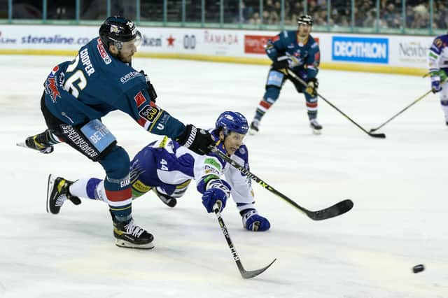 Belfast Giants’ Mark Cooper with Coventry Blaze’s Dane Gibson