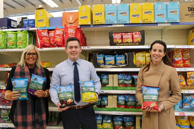 Mary McKillop, Director, Glens of Antrim Crisps (L) and Amy Stewart, Sales Manager, Glens of Antrim Crisps (R), are pictured with Michael Crealey, Tesco Buying Manager for NI
