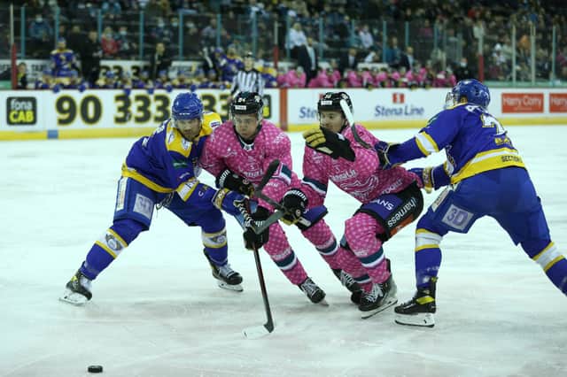 Belfast Giants’ Scott Conway and David Goodwin with Fife Flyers’ James Isaacs during Saturday’s Elite Ice Hockey League game at the SSE Arena, Belfast