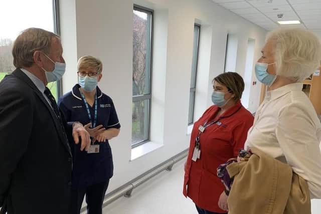 Staff chat with Miss Sue Hill and Professor Mortensen