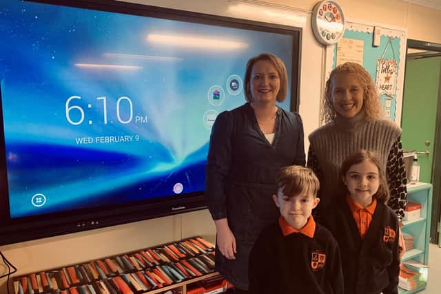 Teacher Hazel Ritchie (left) with two of her primary five pupils and principal Andrea Duff.