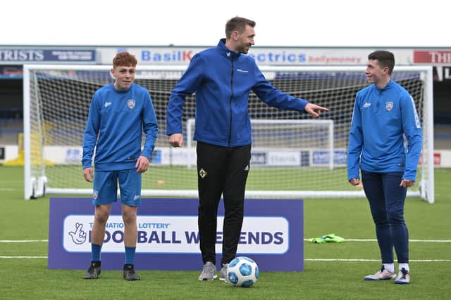 Gareth McAuley pictured with two of Coleraine FC's rising stars