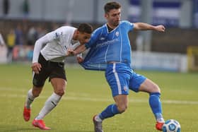 Ballymena United's Mikey Place tangles with Eoin Bradley of Coleraine