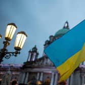 The Ukrainian flag flies during a special vigil at Belfast City Hall last week. Hundreds gathered to protest against the Russian military invasion of Ukraine. Photo: Kirth Ferris/Pacemaker Press