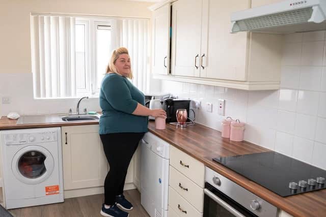 Cullybackey Housing Executive tenant Jennah Kernohan in her recently extended kitchen;