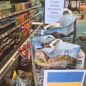 A trolley in the store  for donations from customers.